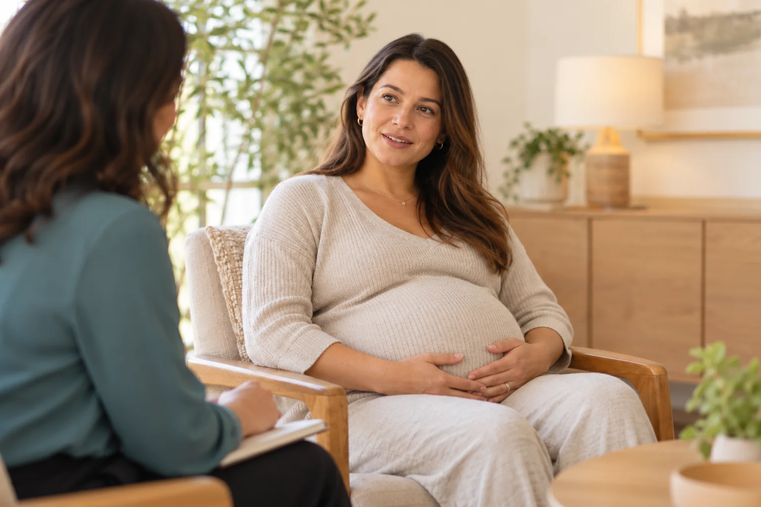 Expectant parent speaking with a healthcare professional
