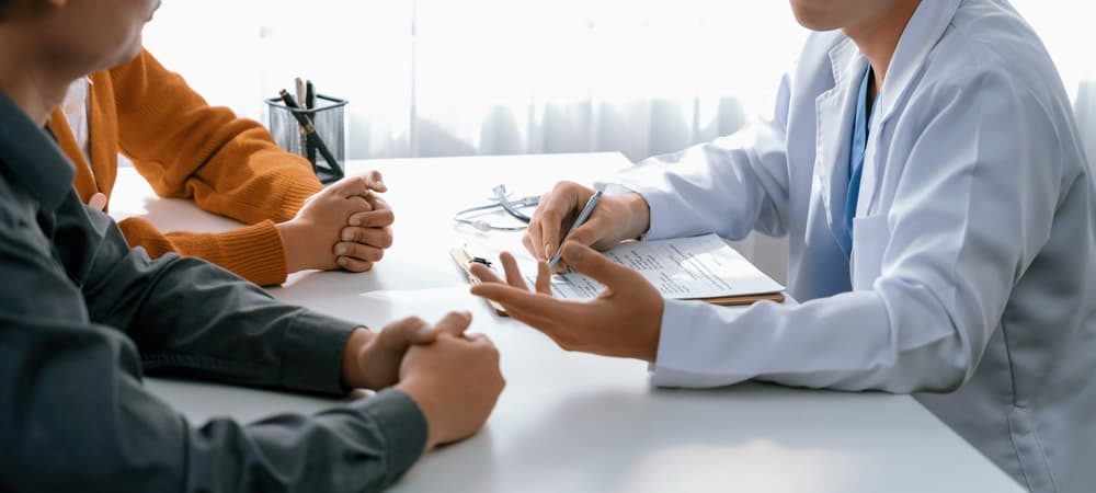 couple talking to doctor about fertility treatments in VA