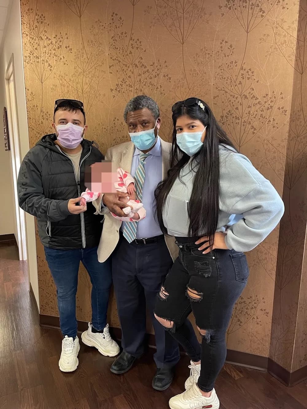 Dr. Jean-Gilles Tchabo with a patient family.